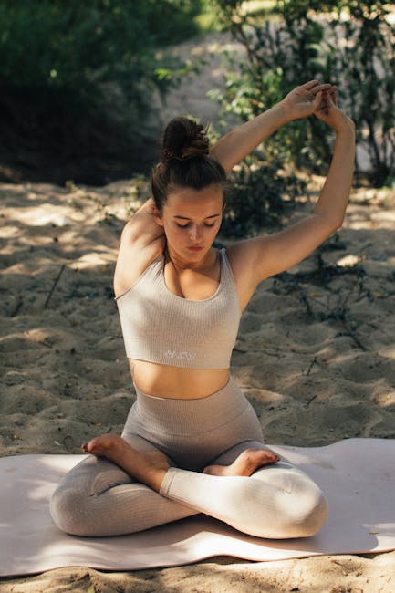 Close-up of a person in a calm, meditative yoga pose, focusing inward